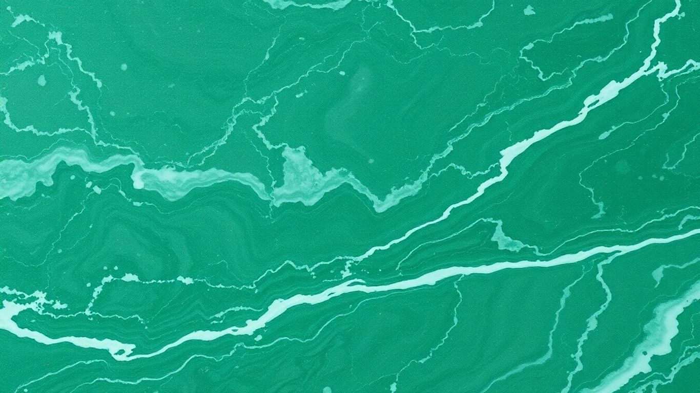 Polished Ming Green marble with swirling green patterns.