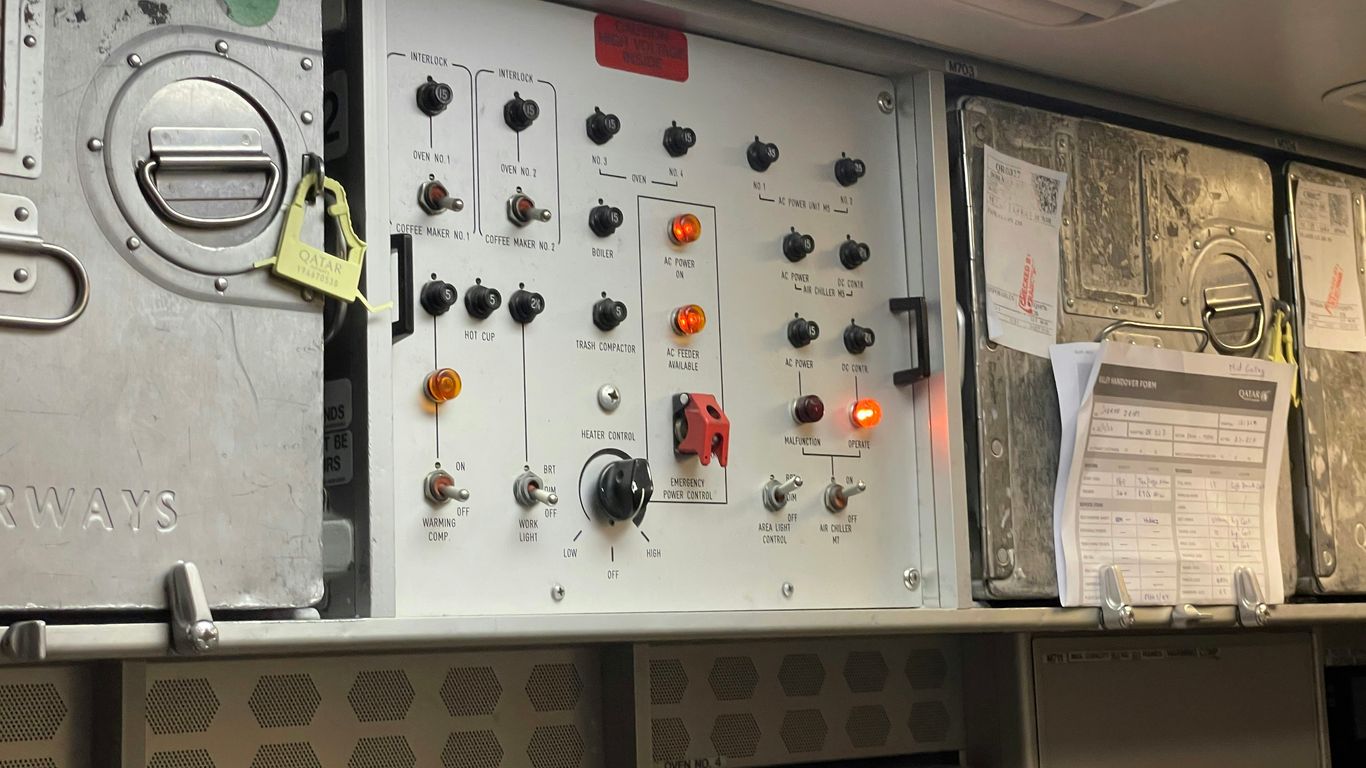 the control panel of an airplane with many buttons