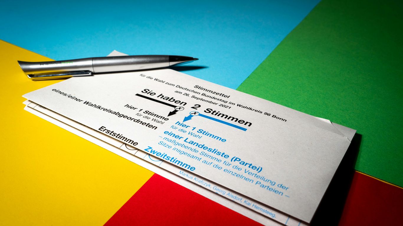 a close up of a pair of business cards and a pen