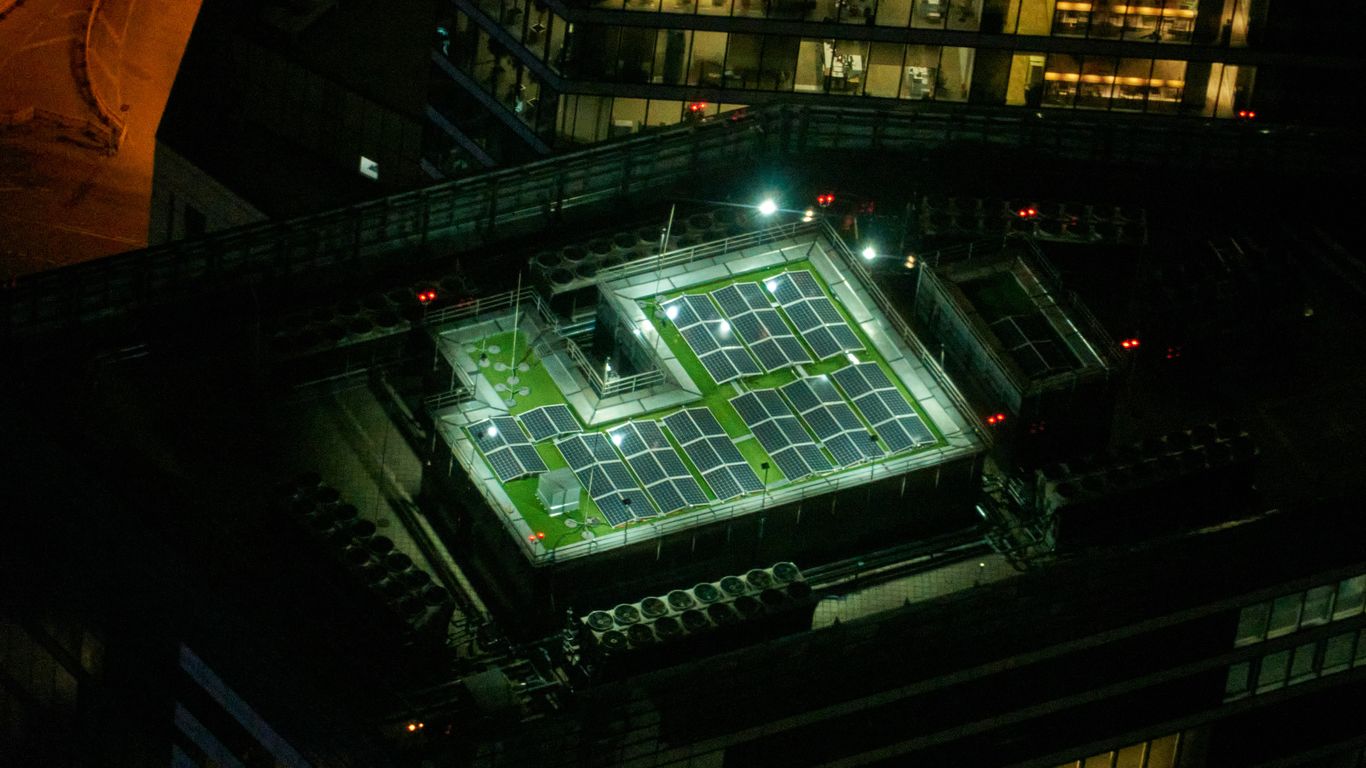 an aerial view of a tennis court at night