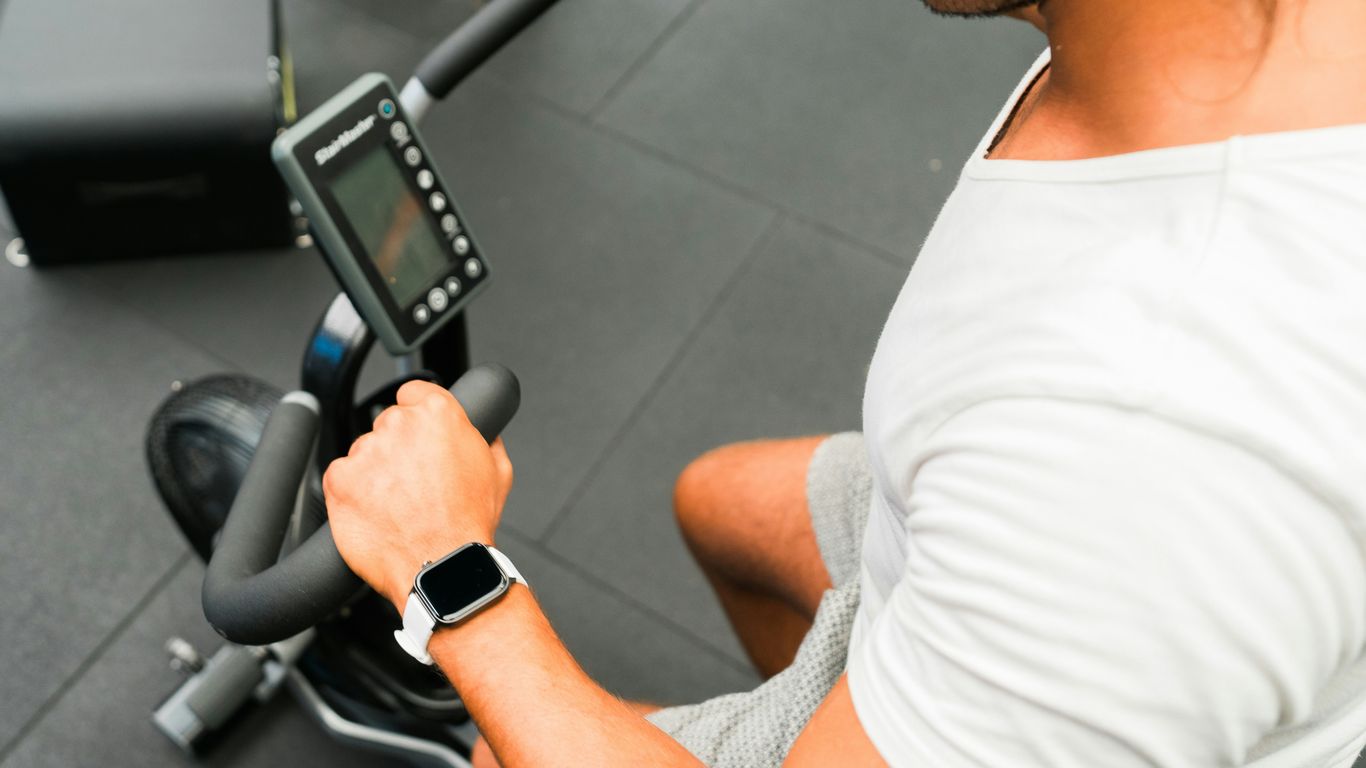 A man sitting on a stationary exercise bike