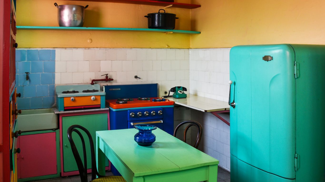 a kitchen with a table and chairs
