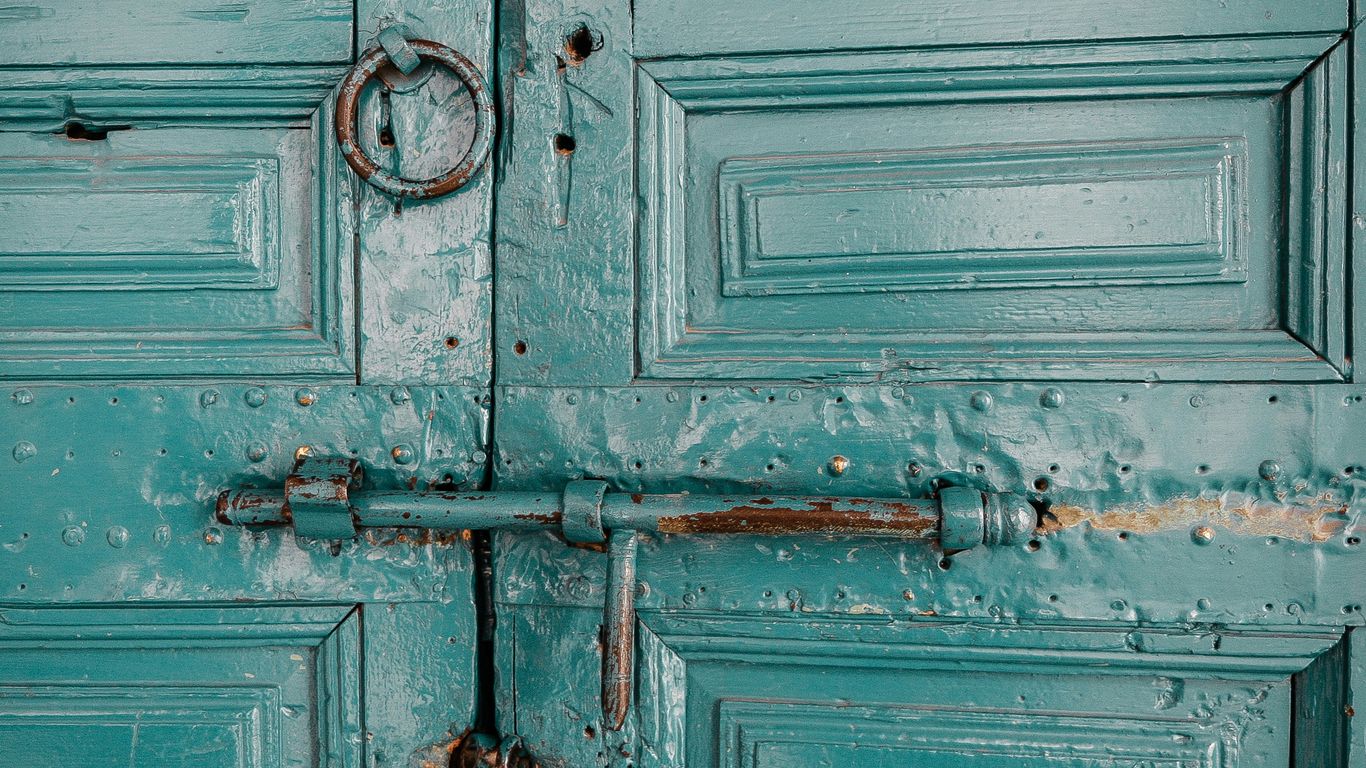 close-up photography of teal door