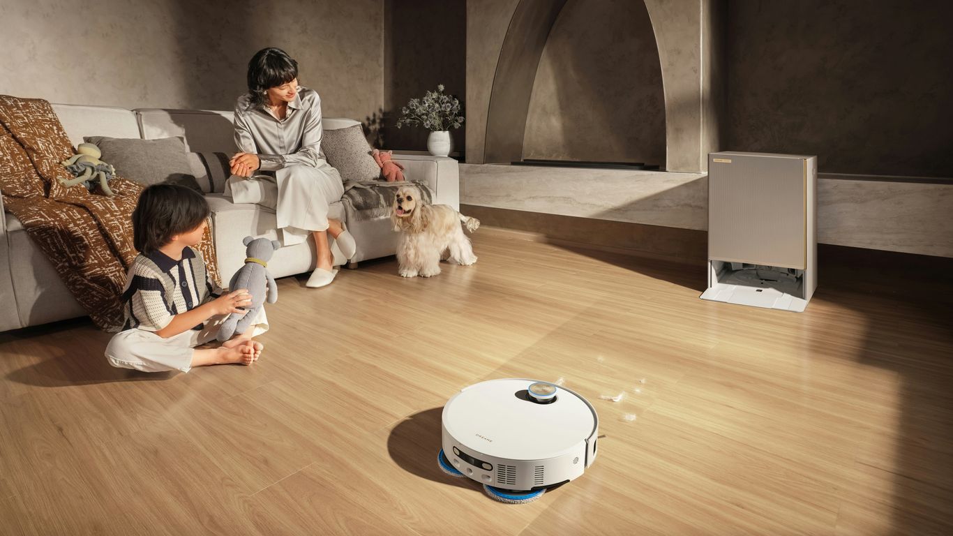 Robot vacuum cleans floor while family relaxes