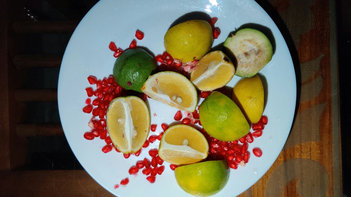 sliced fruit on white plate