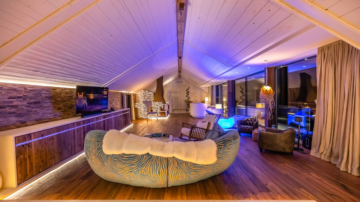 a room with a large bed and a large ceiling