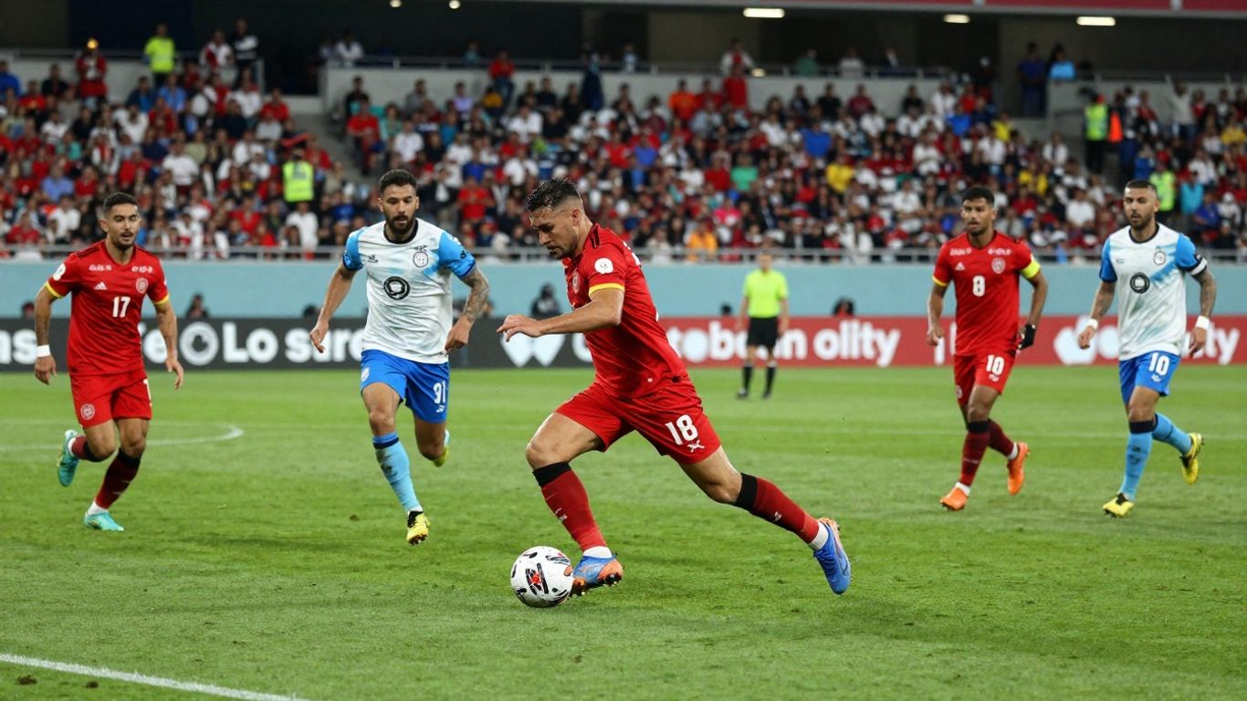 Live football match action on the pitch.