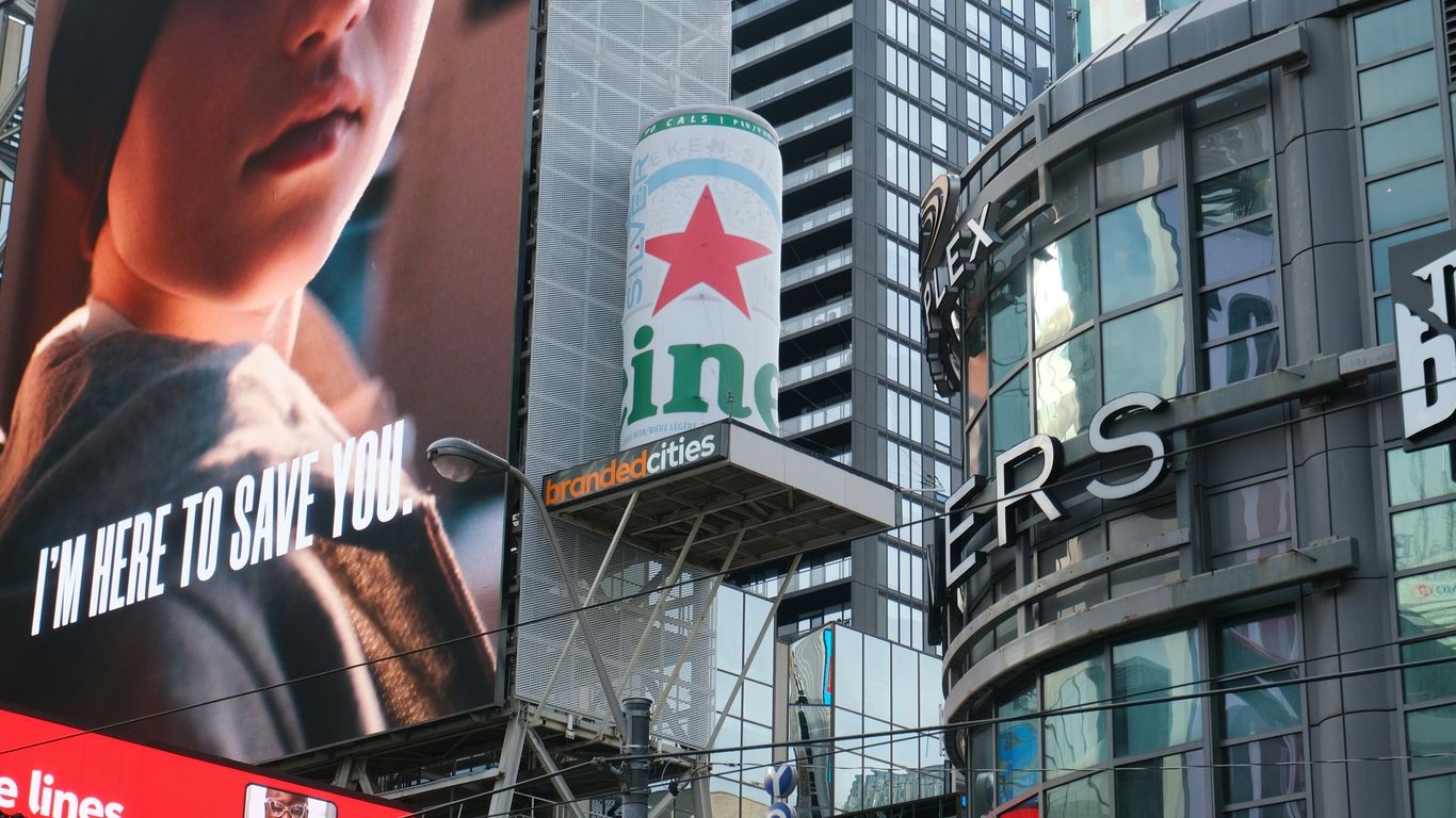 Heineken billboard in a cityscape.