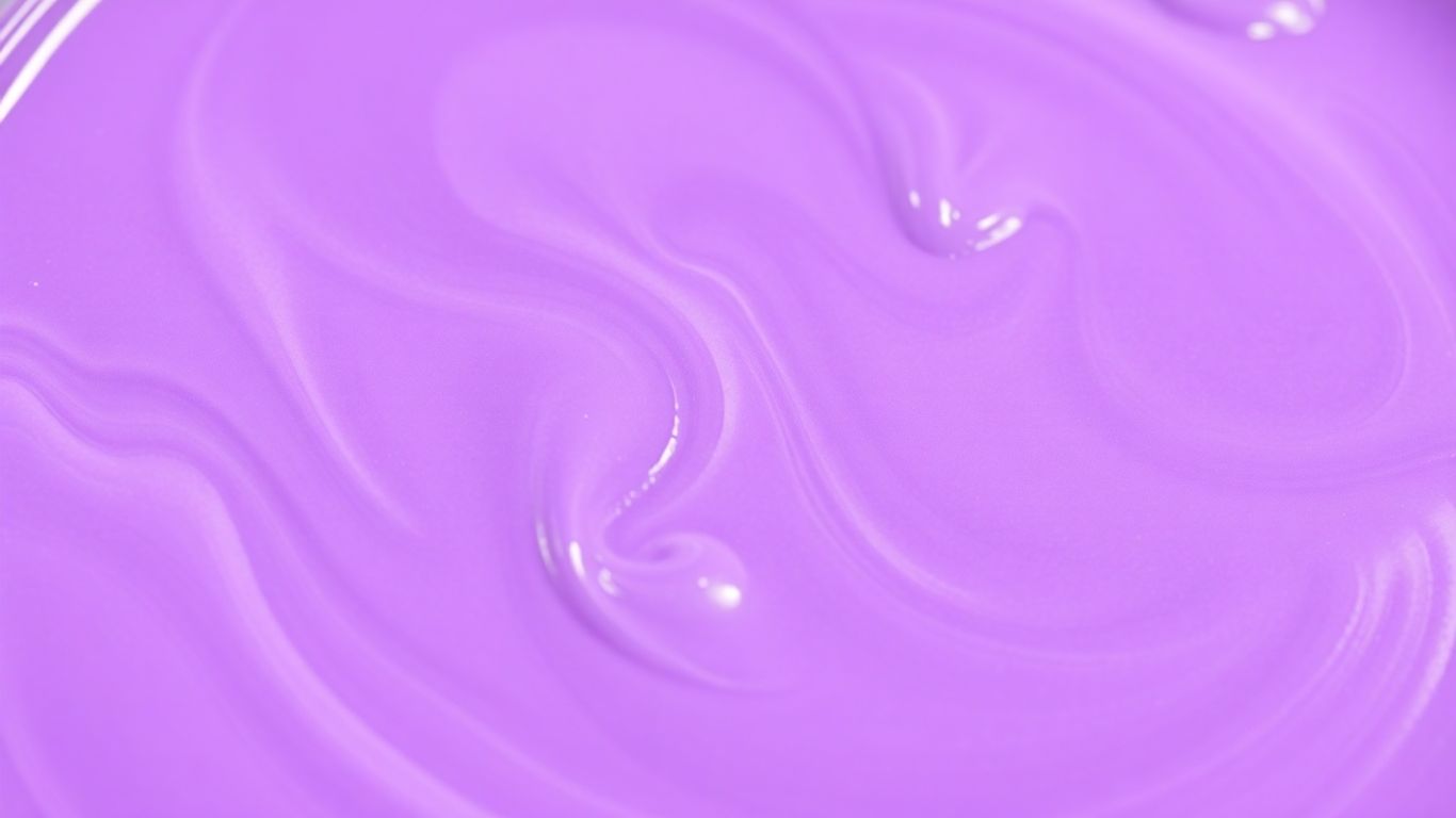 Mixing vibrant purple paint with swirls of color.