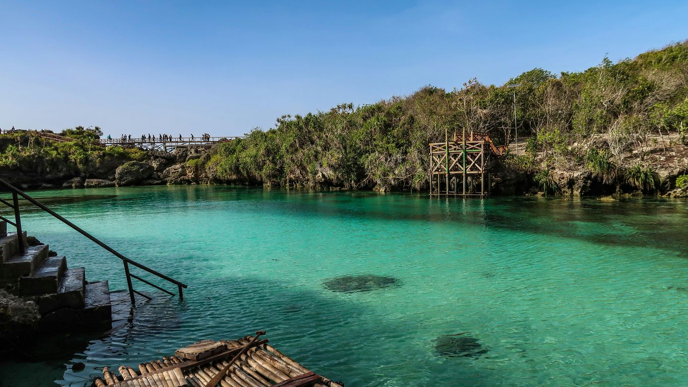 brown wooden dock on body of water during daytime