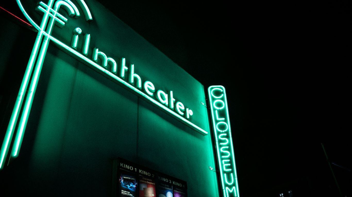green Filmheater LED sign at night
