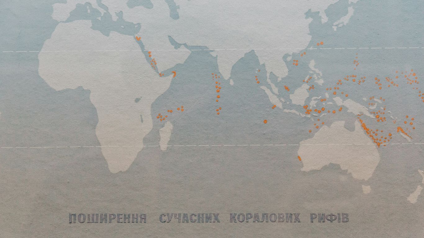 a map of the world with orange dots