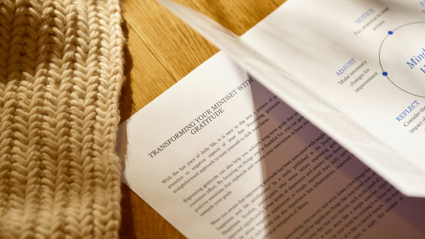 a pair of scissors laying on top of a piece of paper