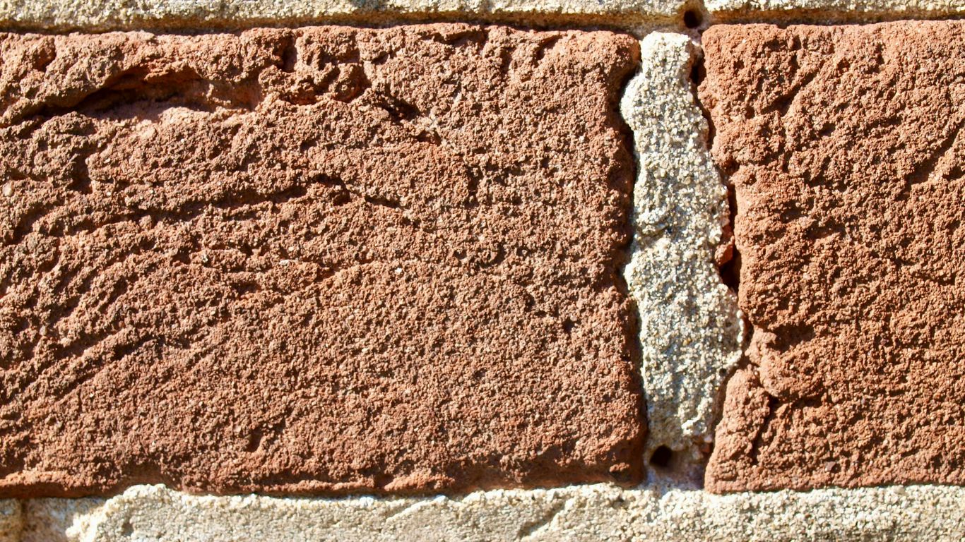 a close up of a brick wall made of bricks