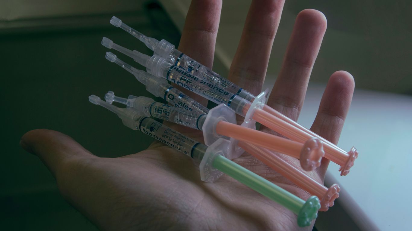 a hand holding a small model of a space ship