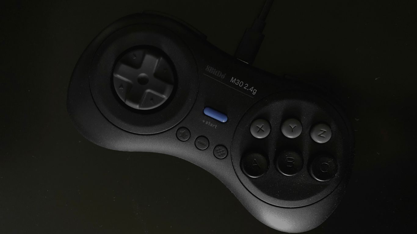 gray and black SEGA Genesis controller