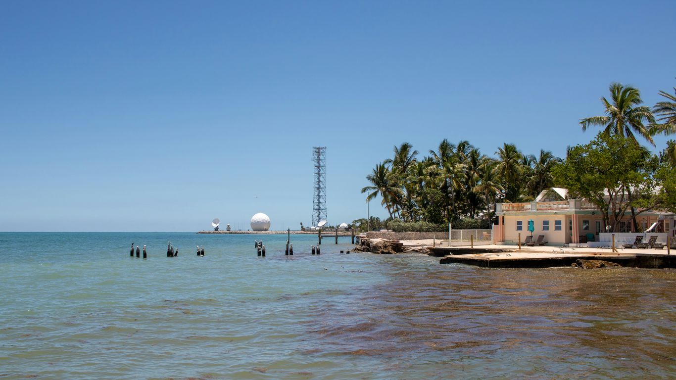 A body of water that has some buildings in it