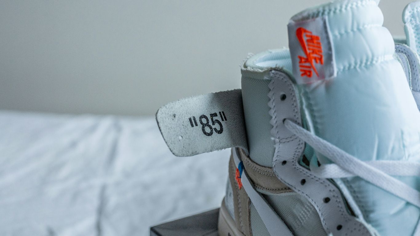 a pair of sneakers with a tag on them