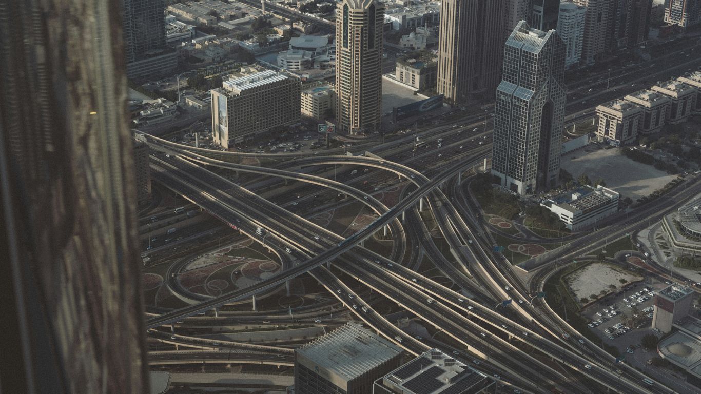 An aerial view of a city with lots of traffic