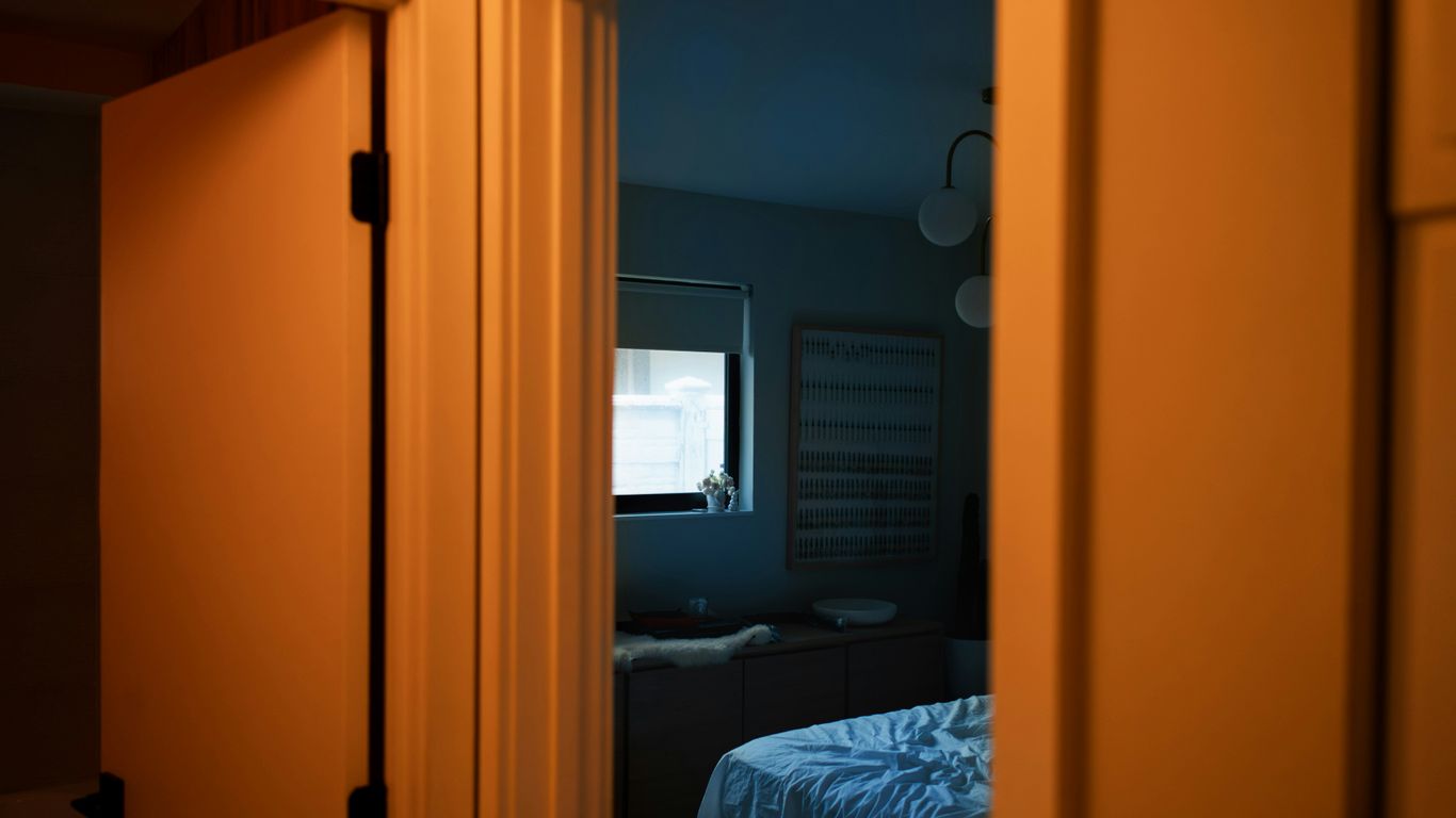 View into a bedroom through an open doorway.
