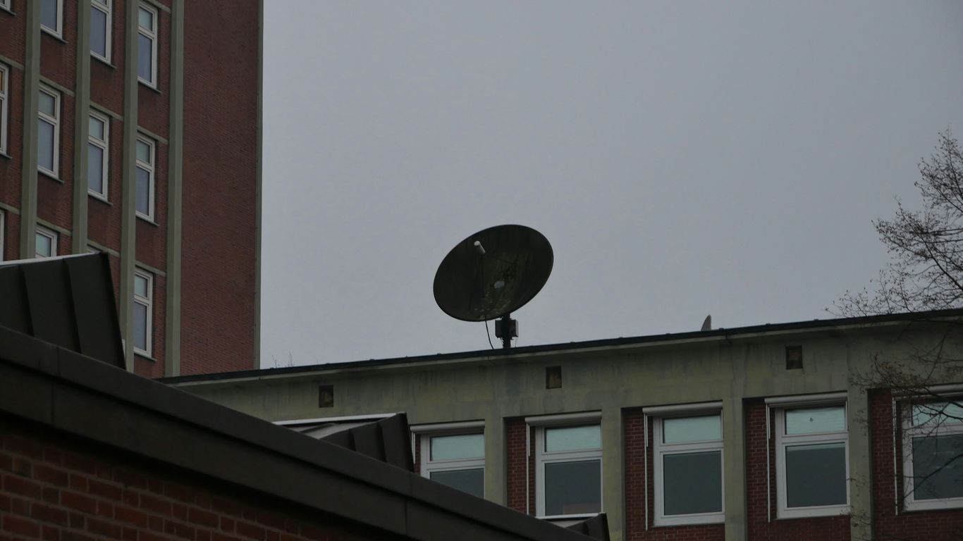 a satellite dish sitting on top of a building
