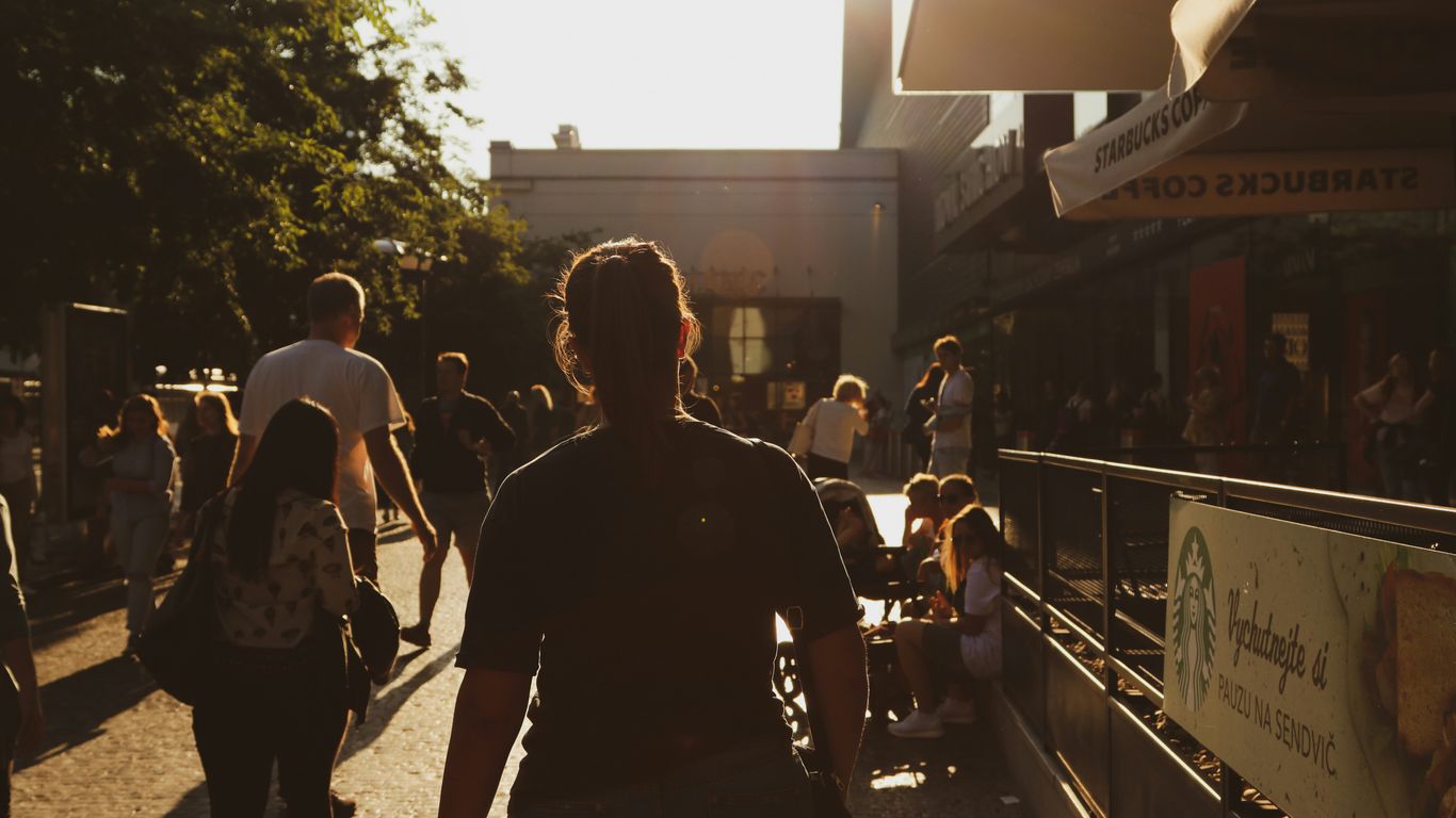 a group of people walking down a street
