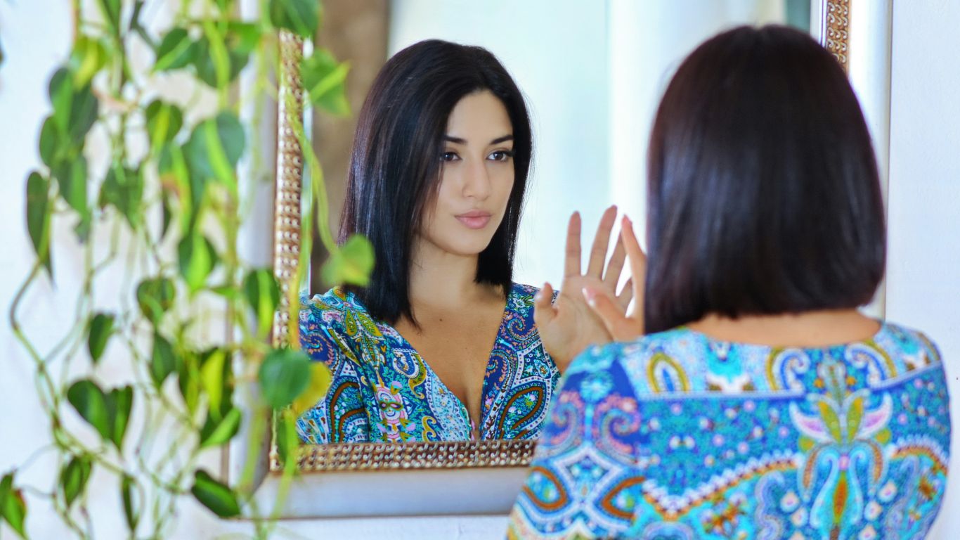 woman in blue and white floral dress
