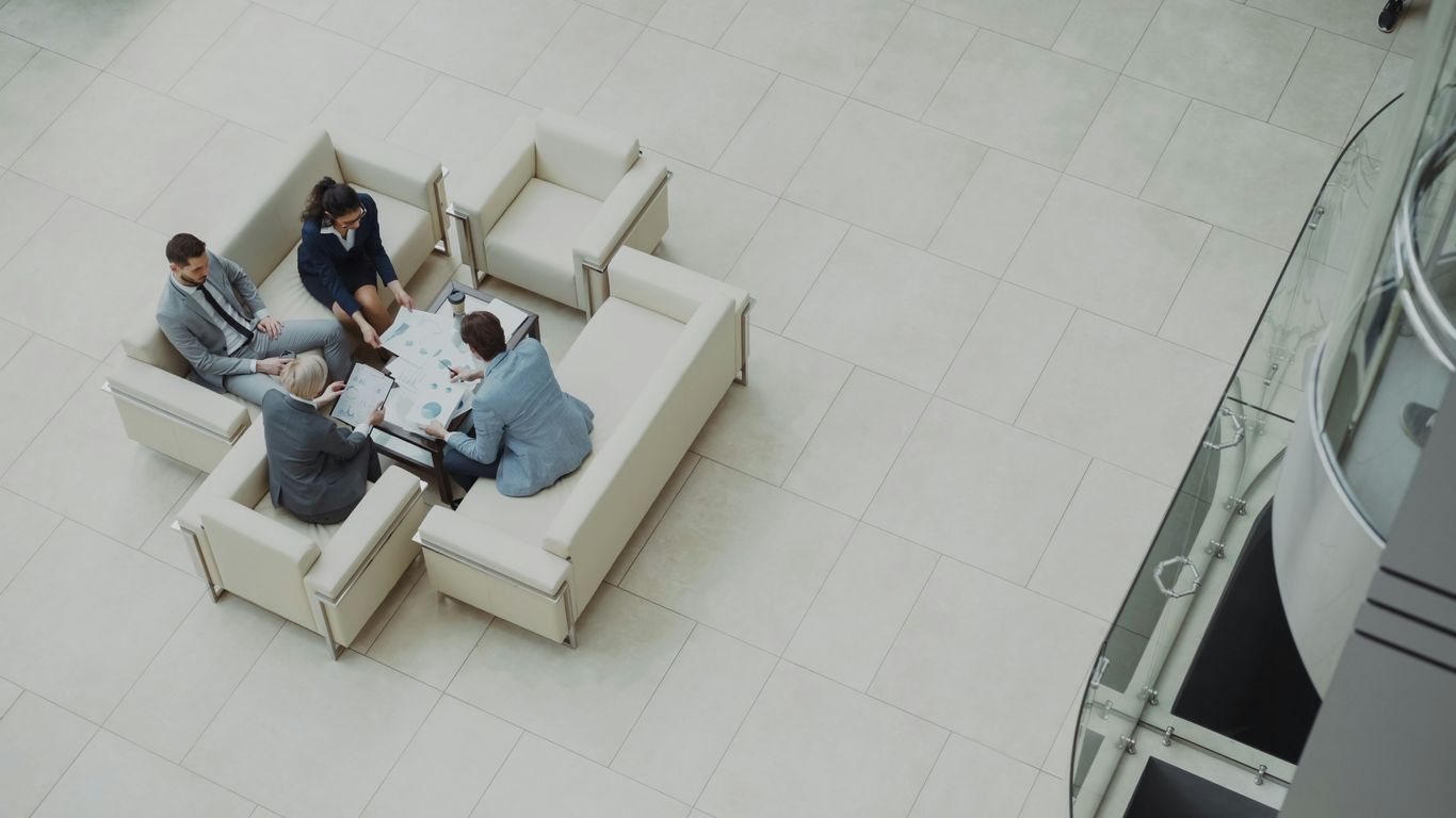 Business meeting around a table on sofas.