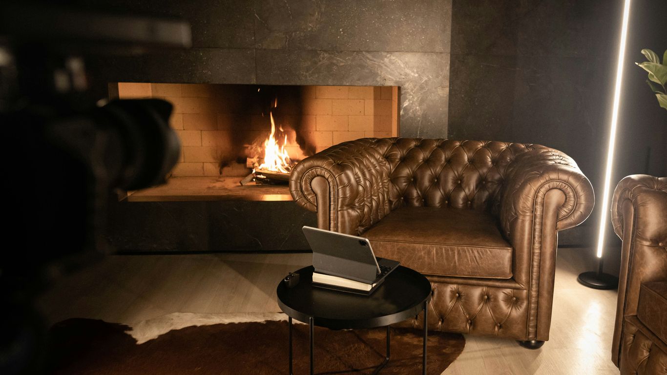 a living room filled with furniture and a fire place