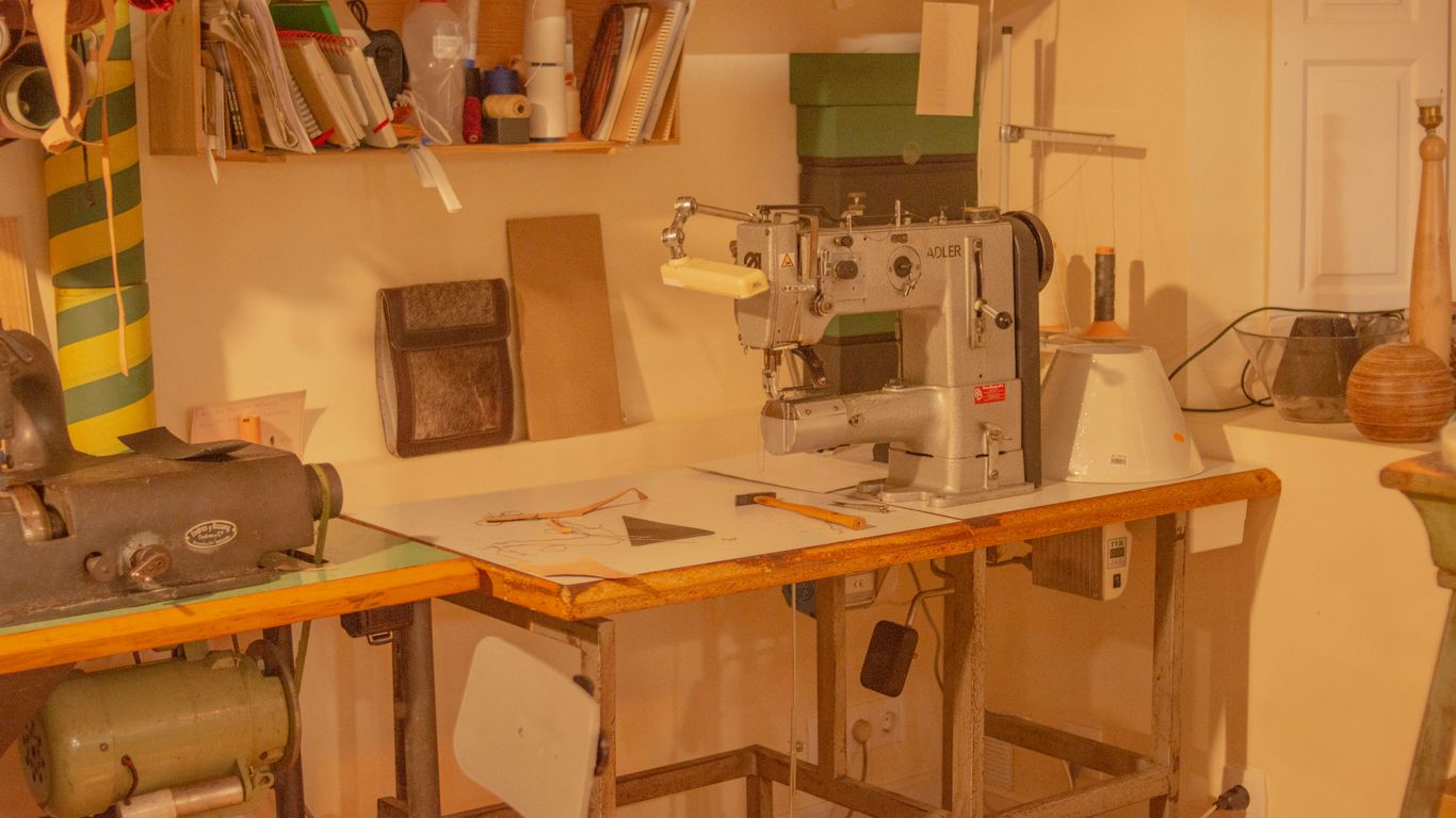 a sewing machine sitting on top of a wooden table