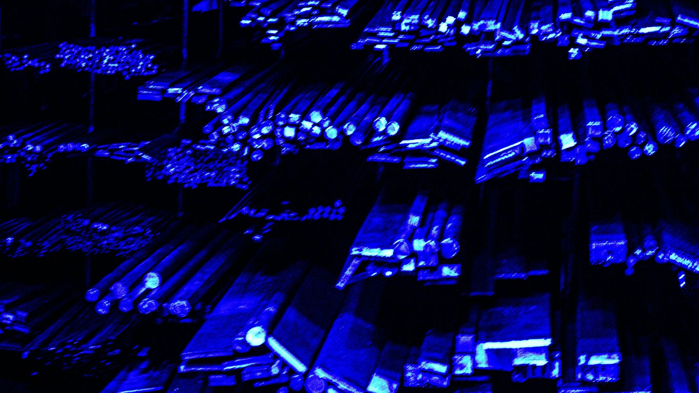 Rows of metal bars illuminated with blue light