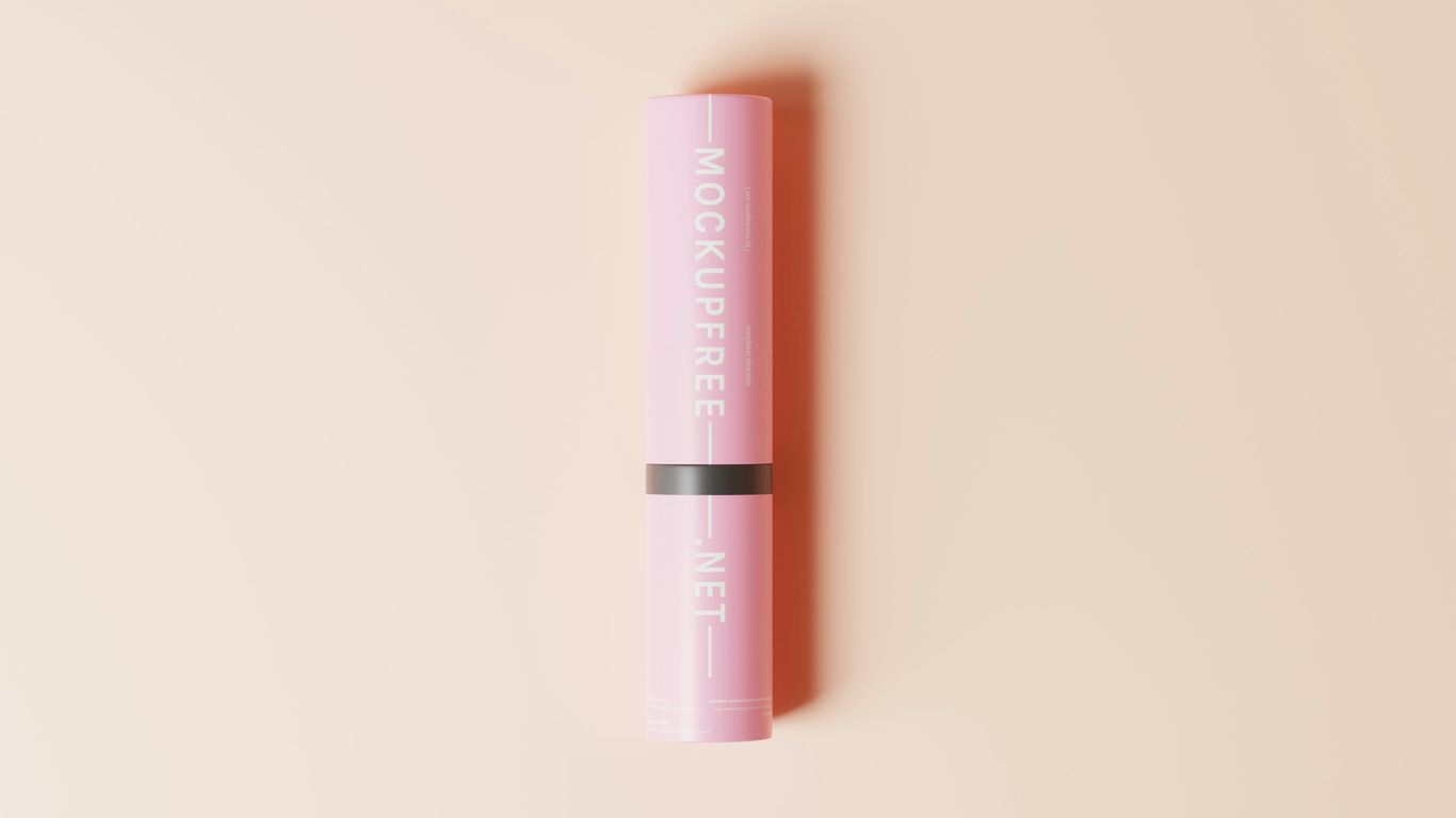 a pink lip bale sitting on top of a pink surface