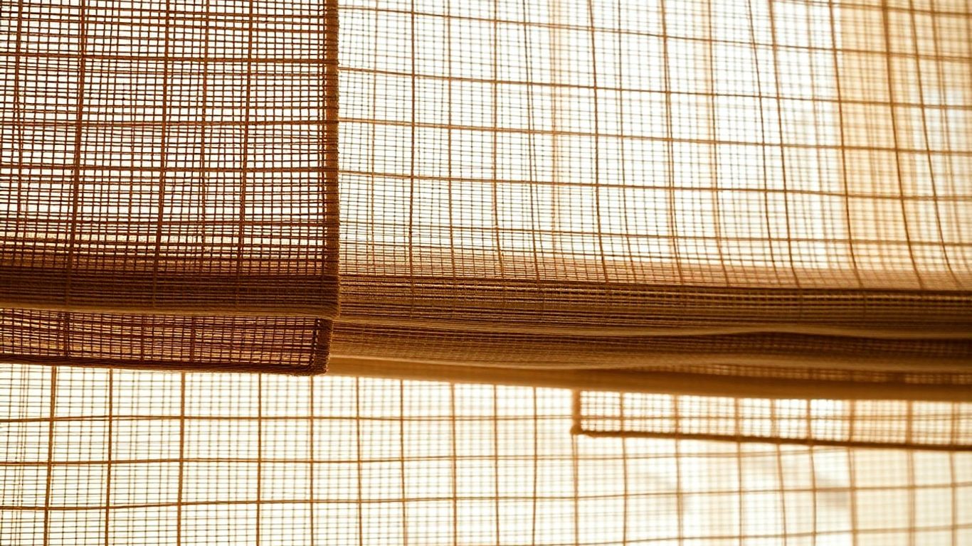 Eco-friendly natural woven window shades with soft light filtering.