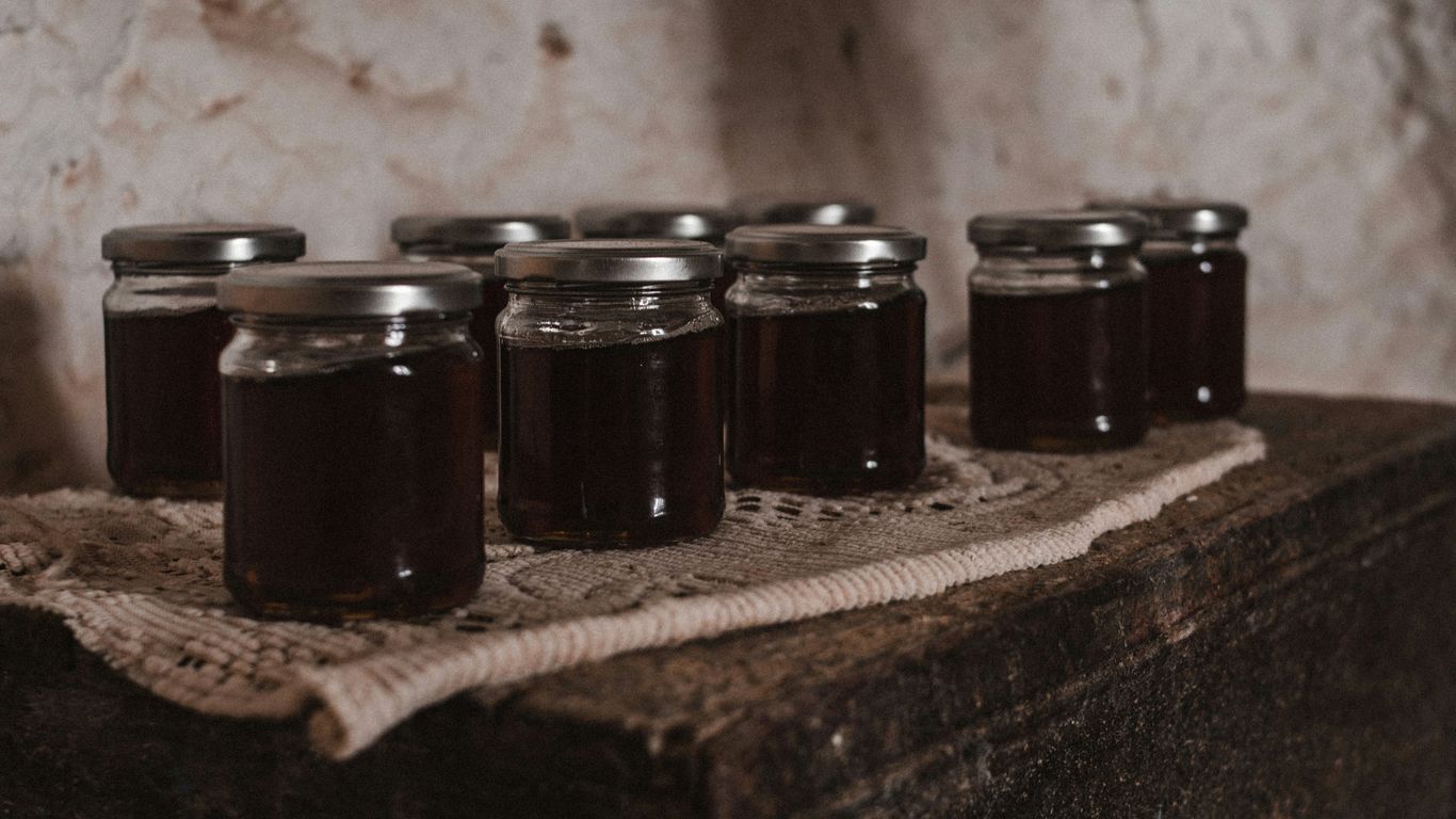a bunch of jars that are sitting on a table