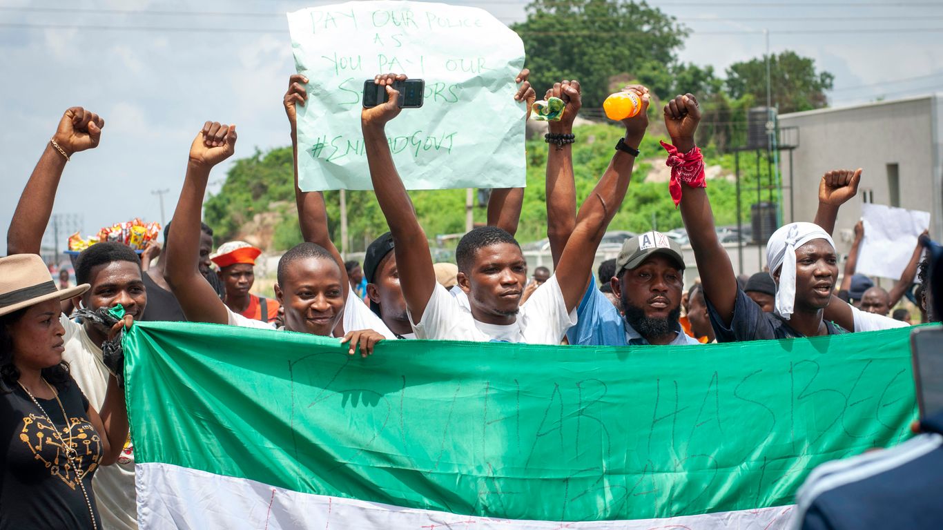 group of people on blue inflatable pool during daytime