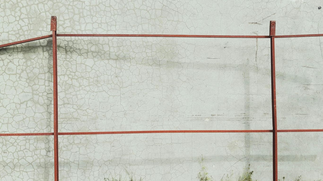 white and red metal fence