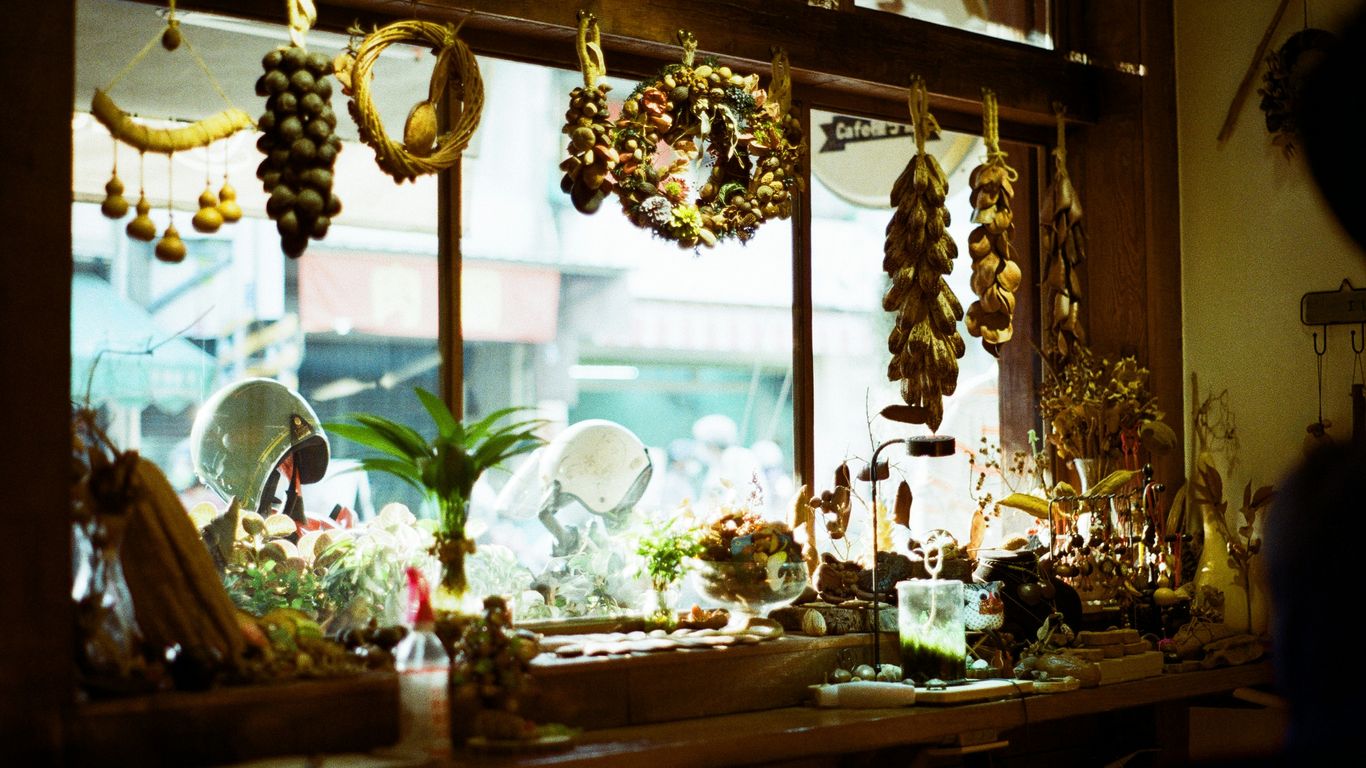 a window with a bunch of hanging items on it