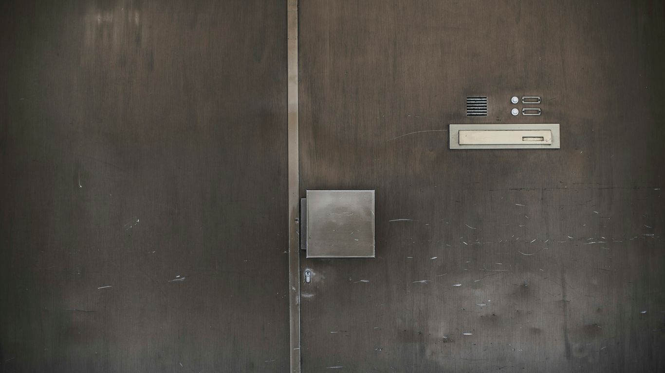 black wooden door with silver door lever