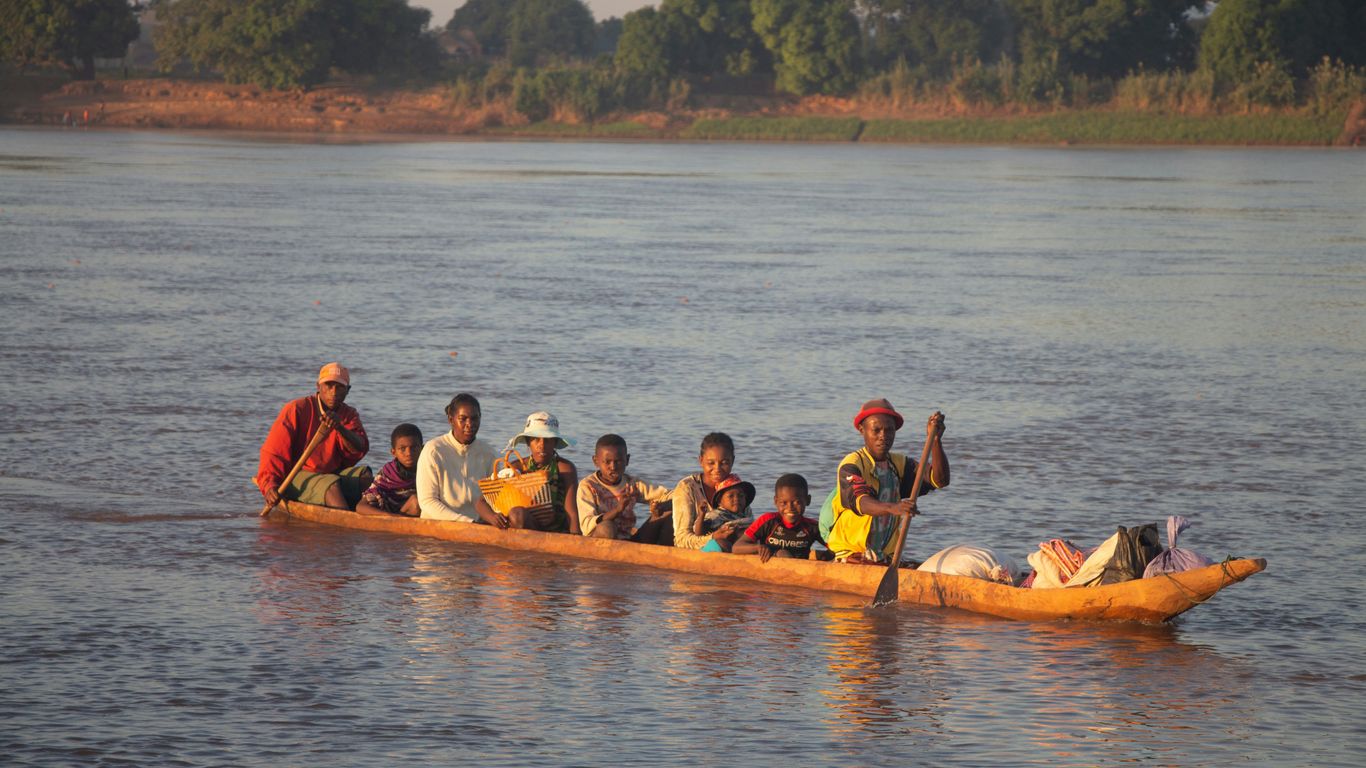 people riding on kayak on body of water during daytime