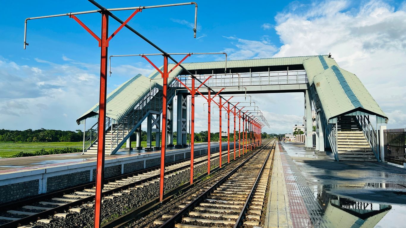 train tracks next to a building