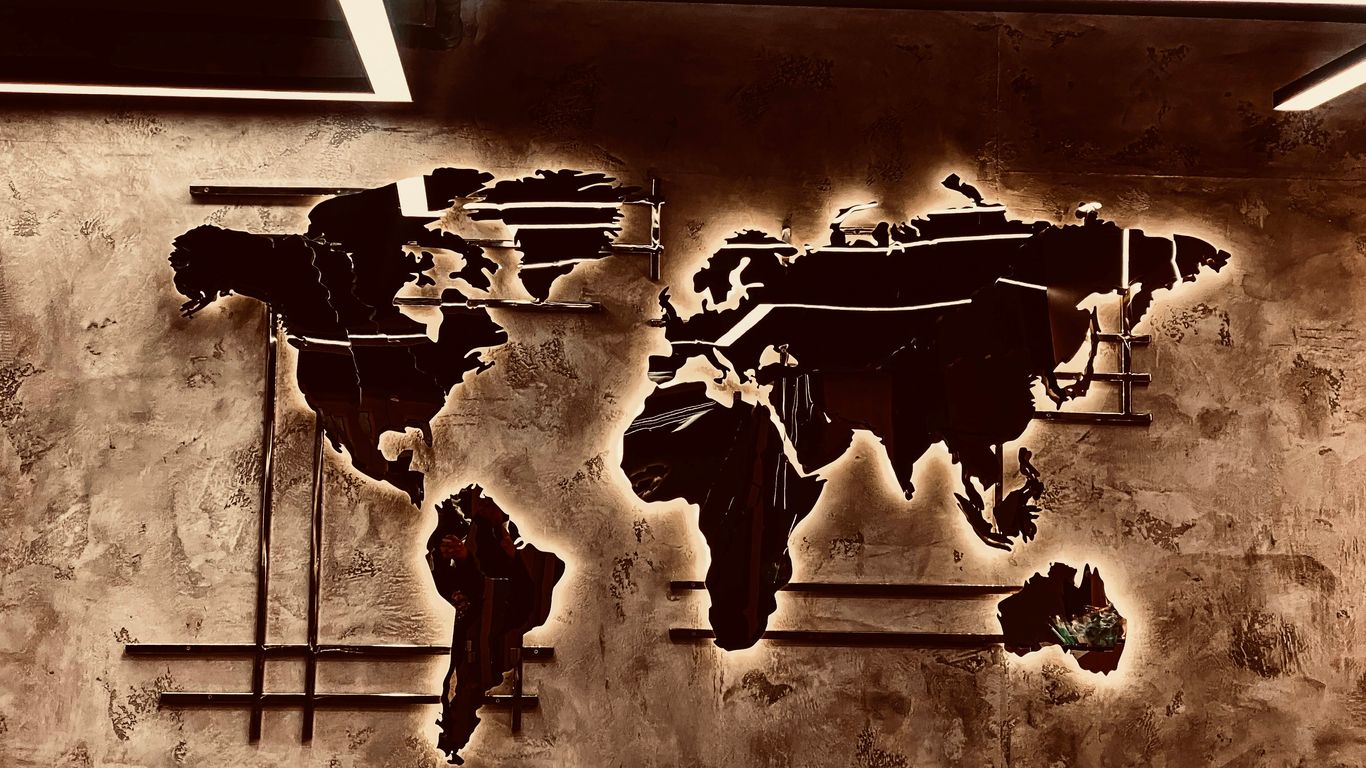 A picture of a world map on a wall