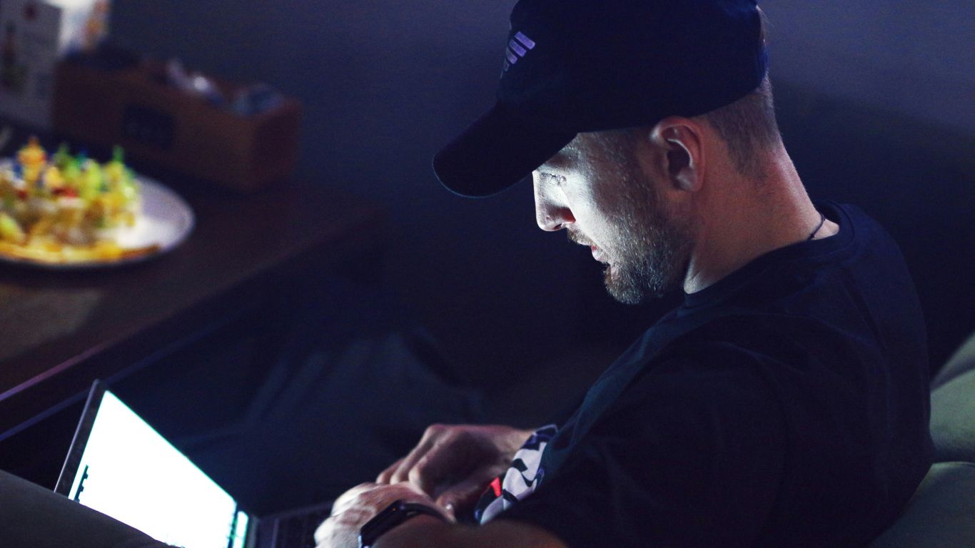 a man sitting in front of a computer