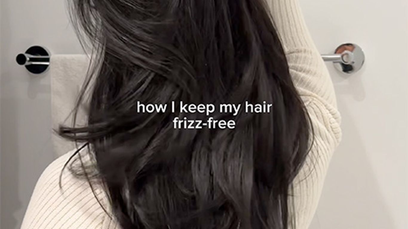 Person showing lustrous hair, text hints at frizz-free haircare tip.