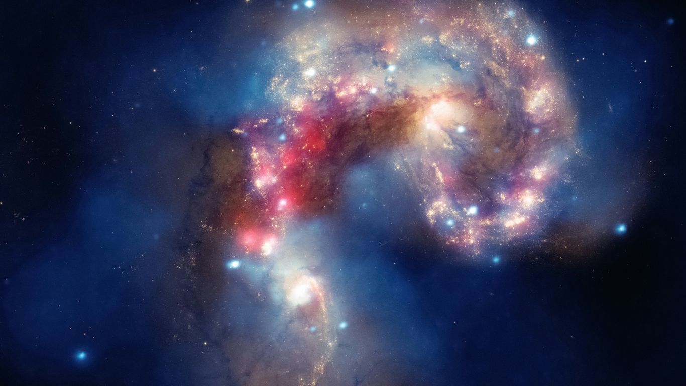 two spiral shaped objects in the middle of the night sky