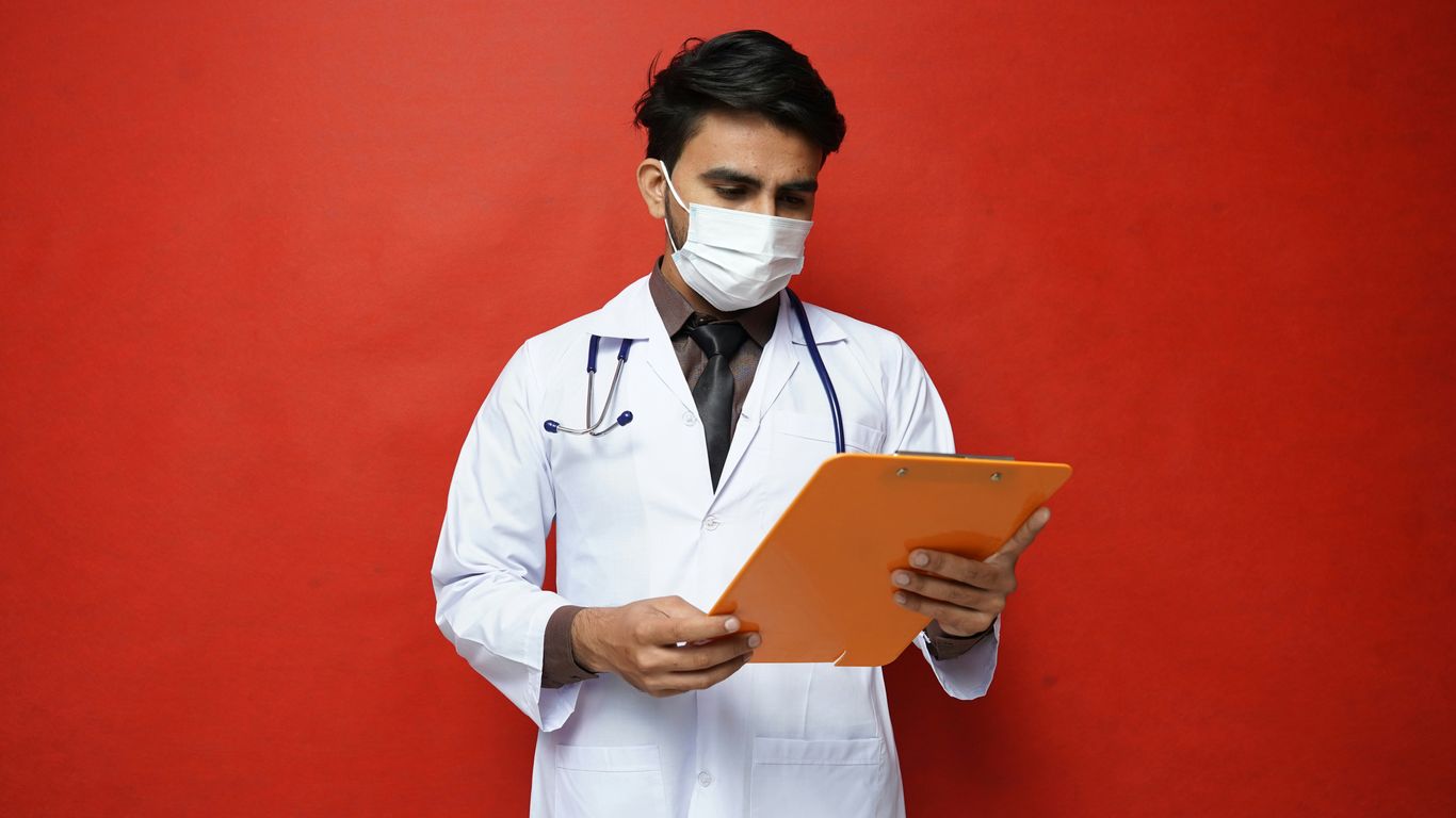 a doctor holding a tablet
