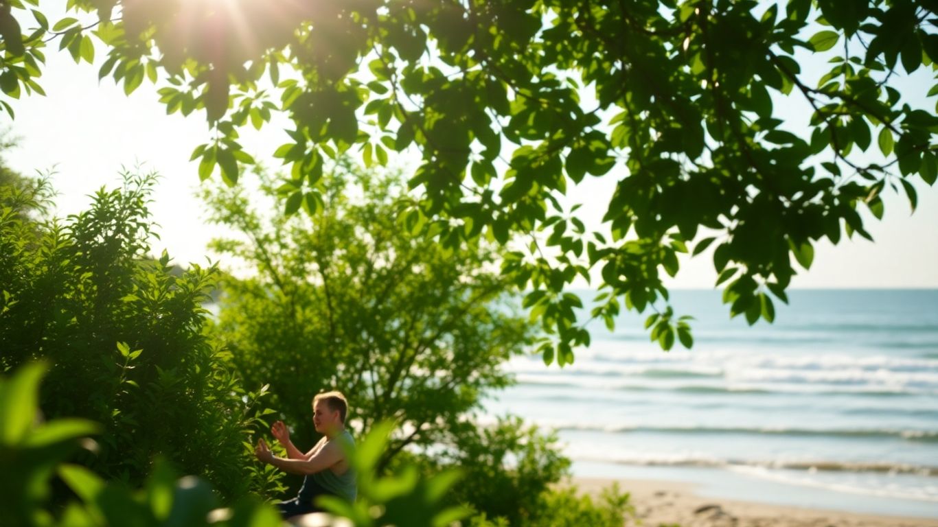 Person meditating peacefully by calm water and trees.