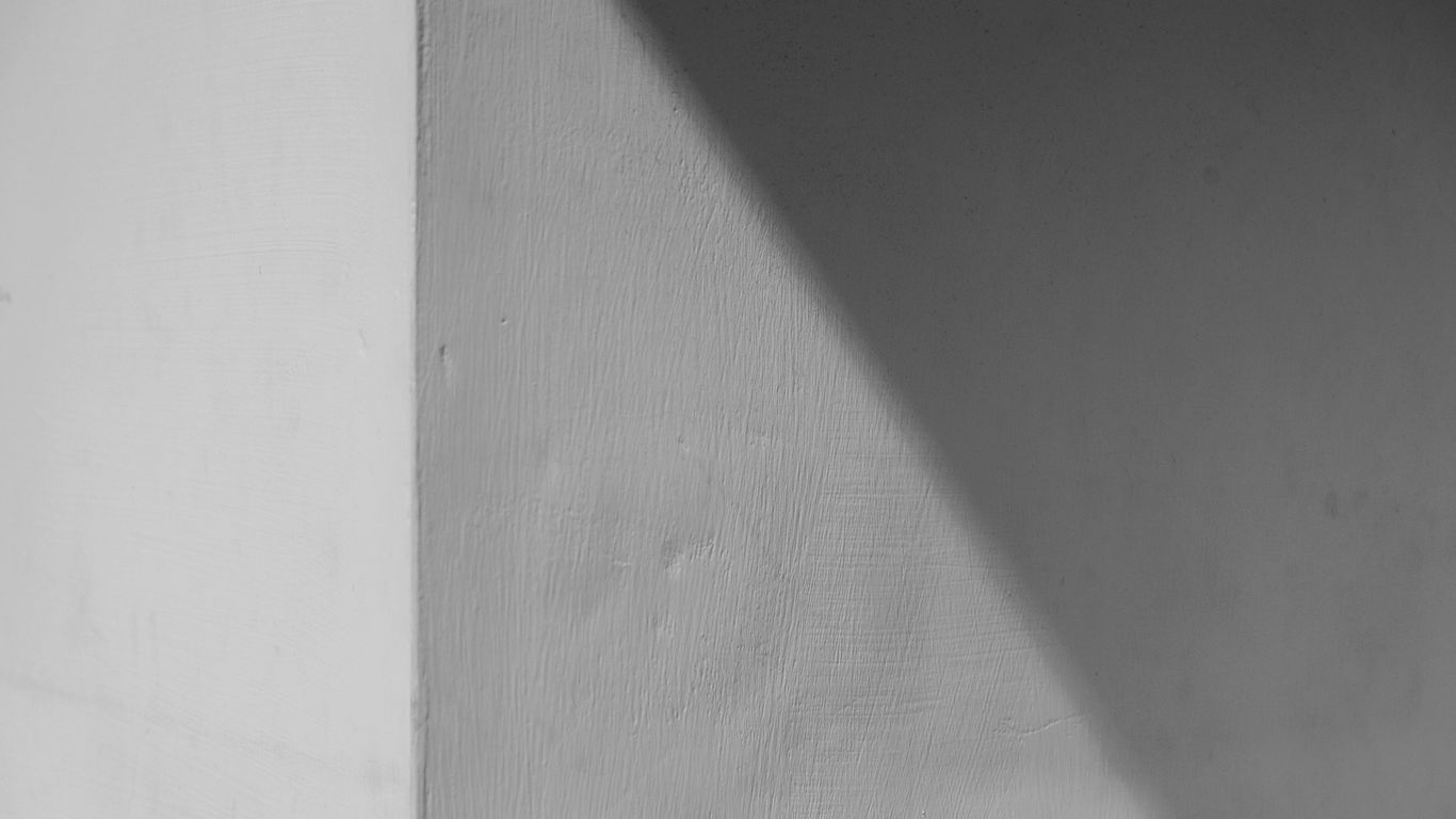 a black and white photo of a person on a skateboard