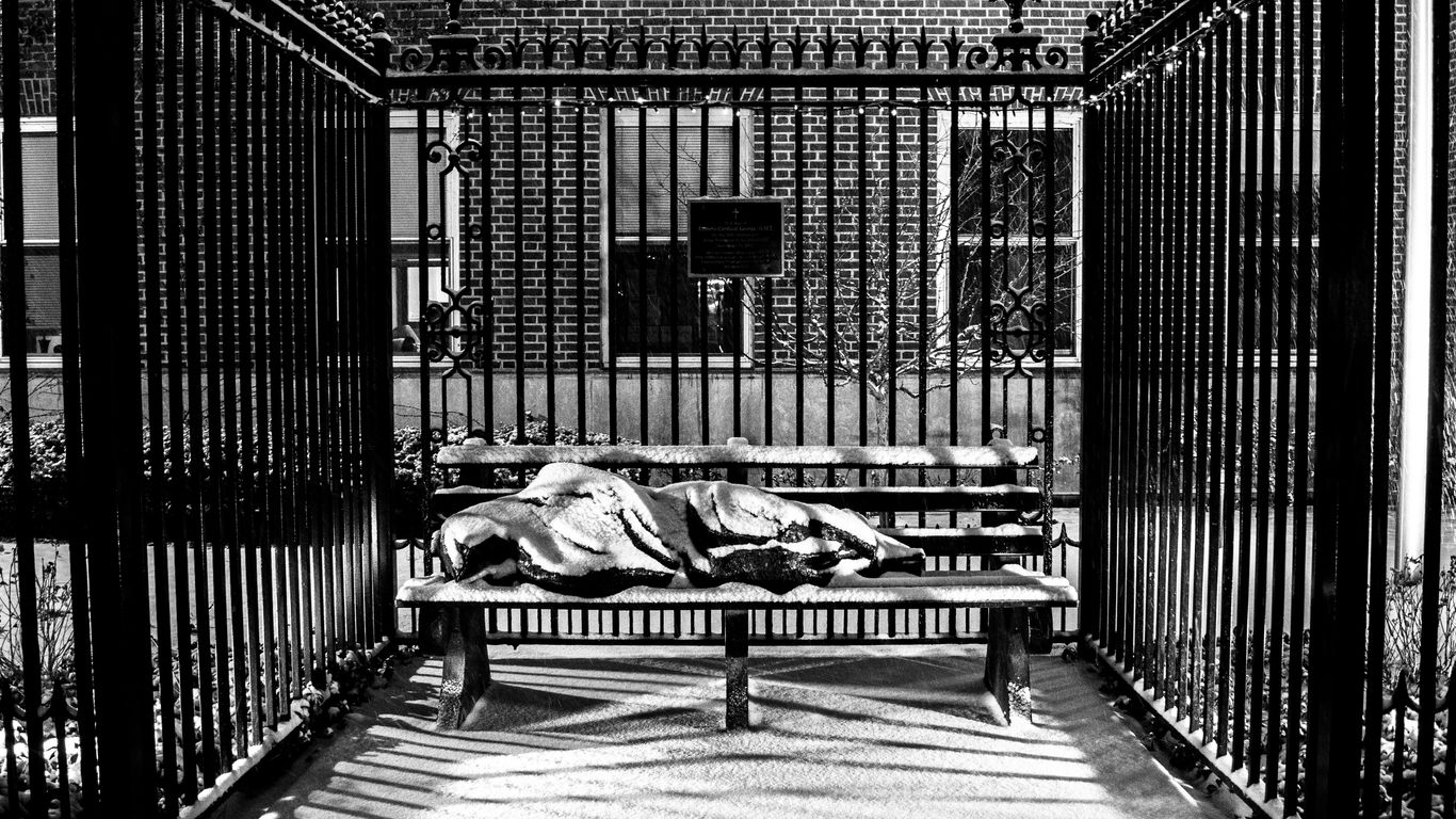 grayscale photo of 2 women lying on wooden floor