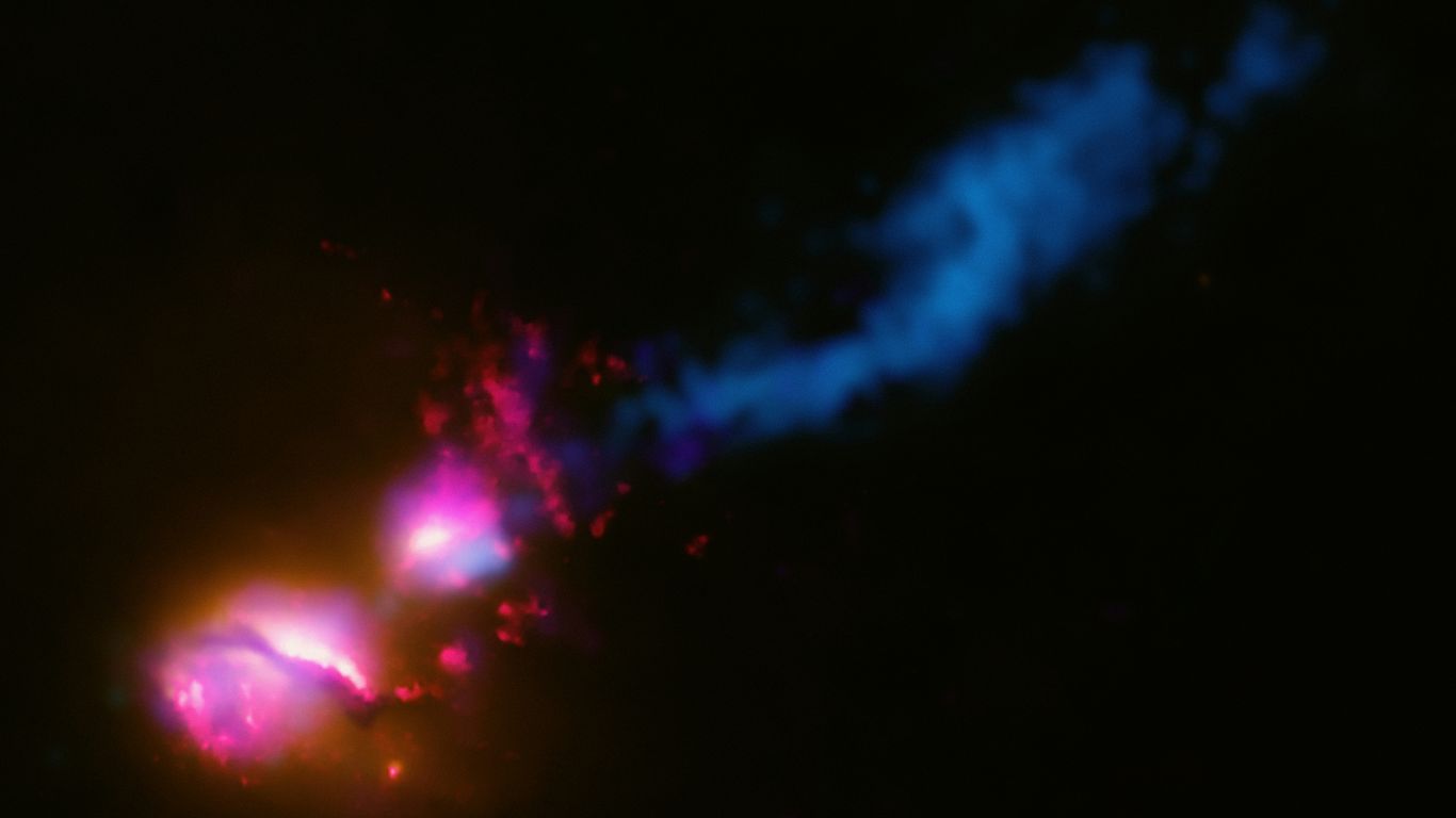 a blurry image of a blue and pink object in the dark