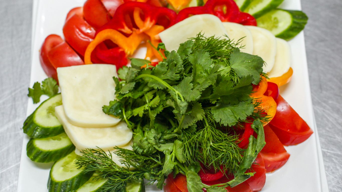 a white plate topped with sliced up veggies
